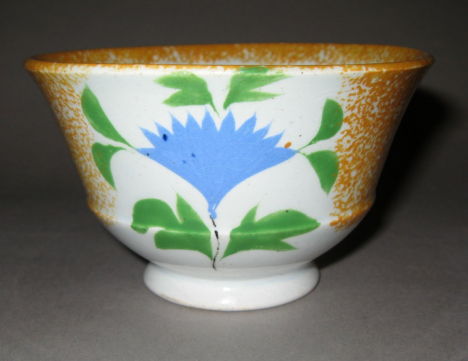 1963.0602 A Cockscomb pattern spatter teabowl