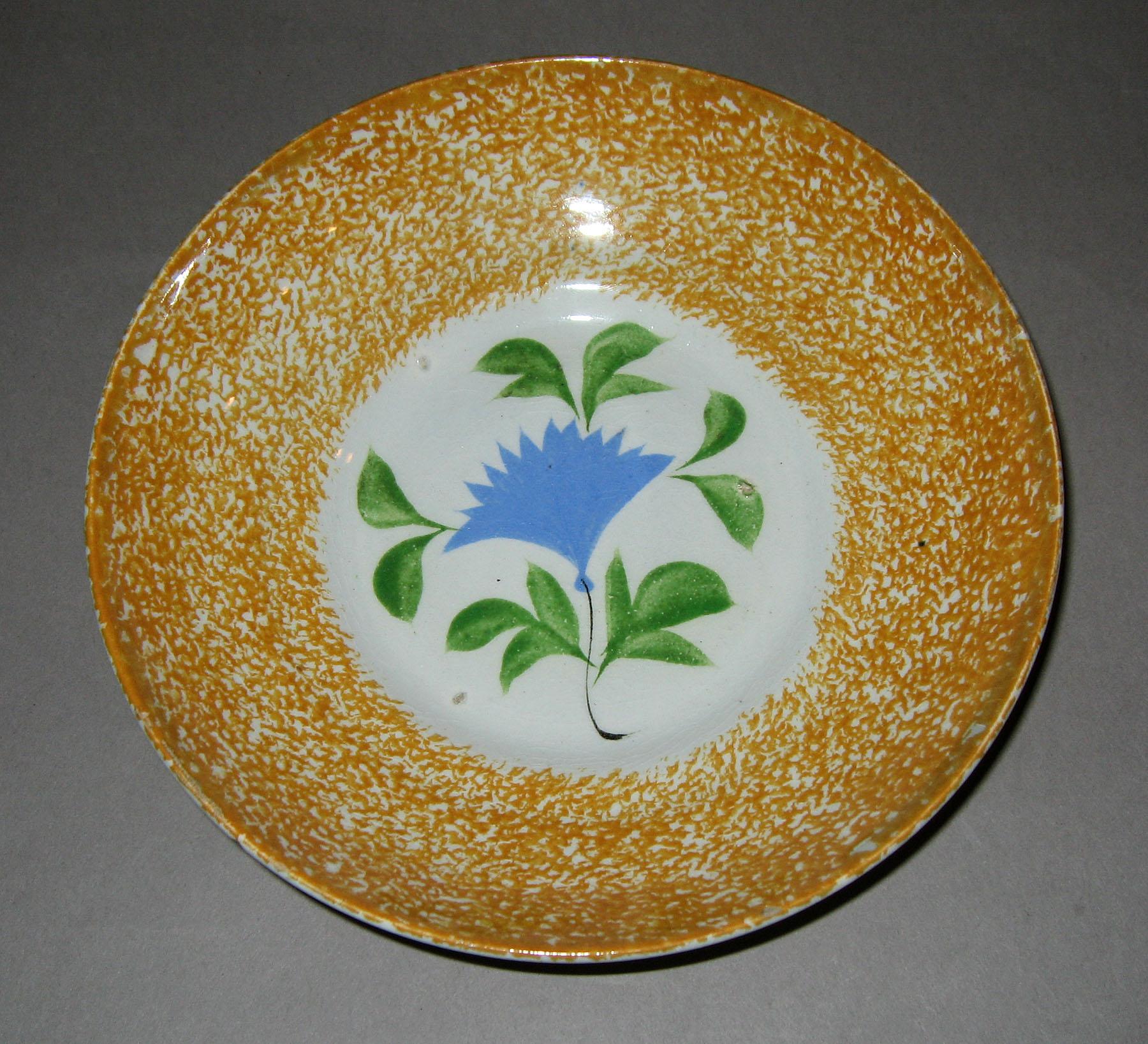 1963.0602 B Cockscomb pattern spatter saucer