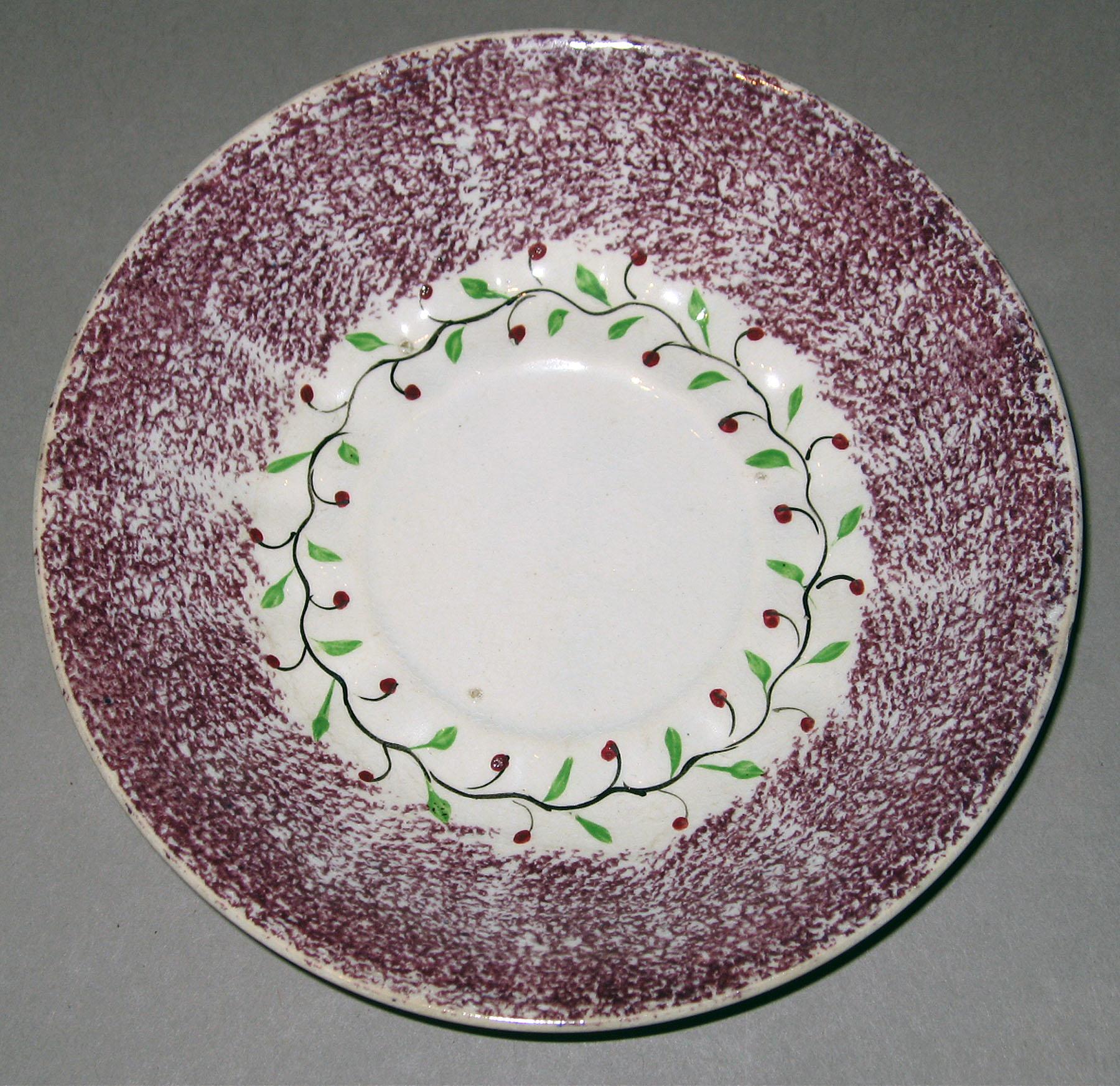 1963.0612.002 B Spatterware saucer
