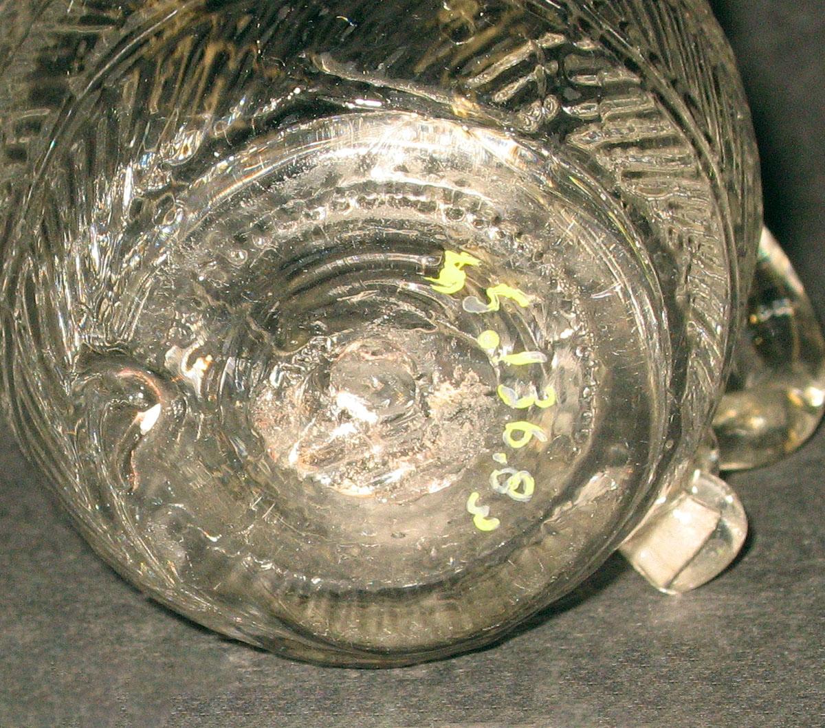1955.0136.083 Glass jug (underside)