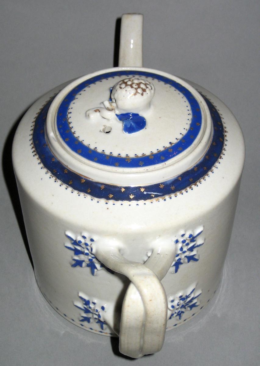 1963.0754.002 A, B Porcelain Teapot top and back