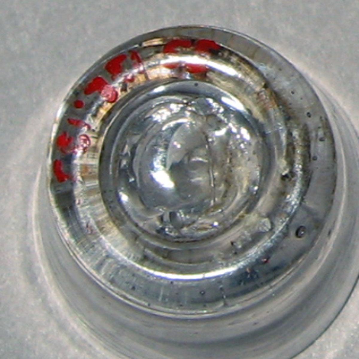 1955.0136.133 Miniature glass tumbler (underside)