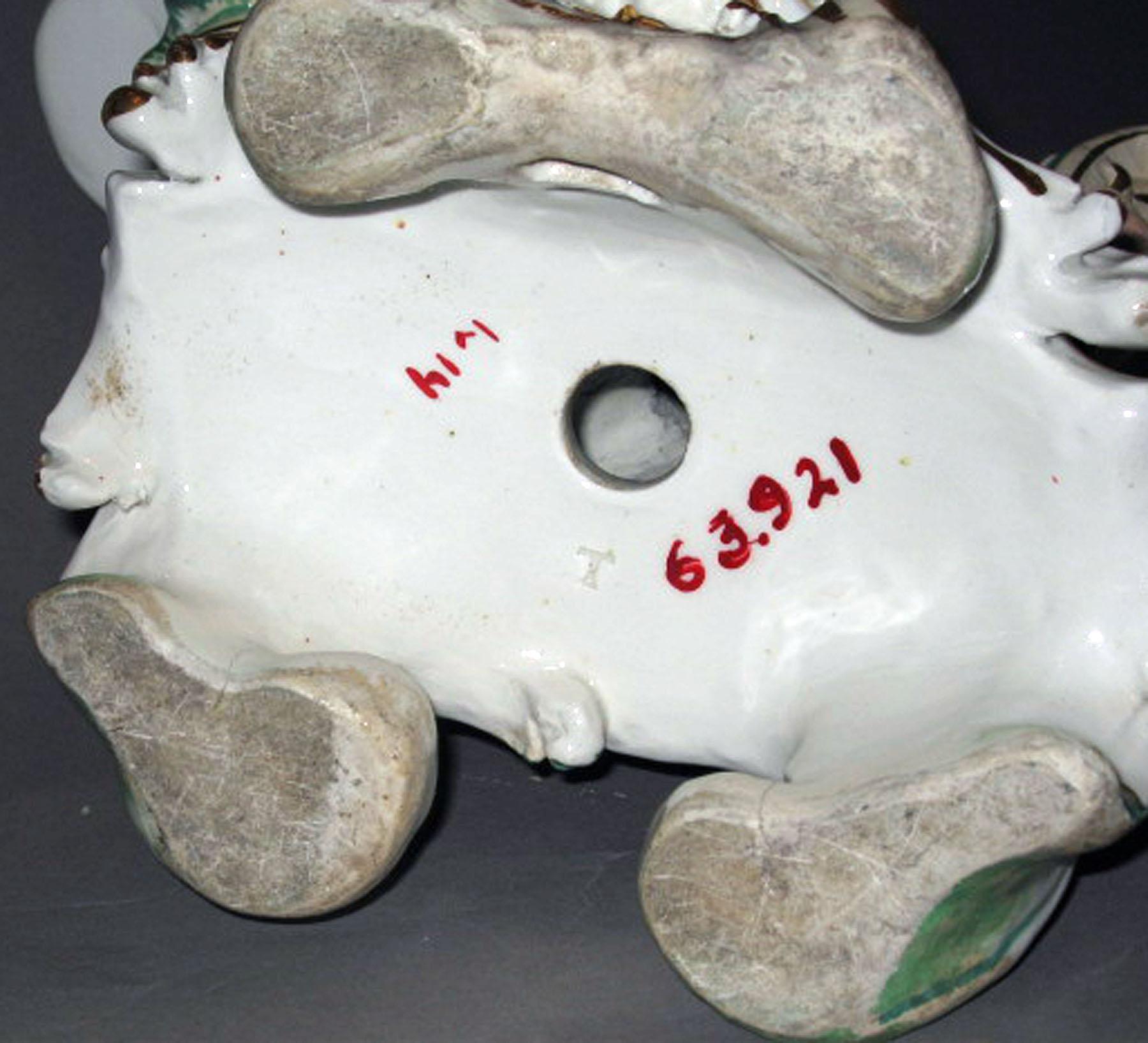 1963.0921 Porcelain candlestick figure (underside)