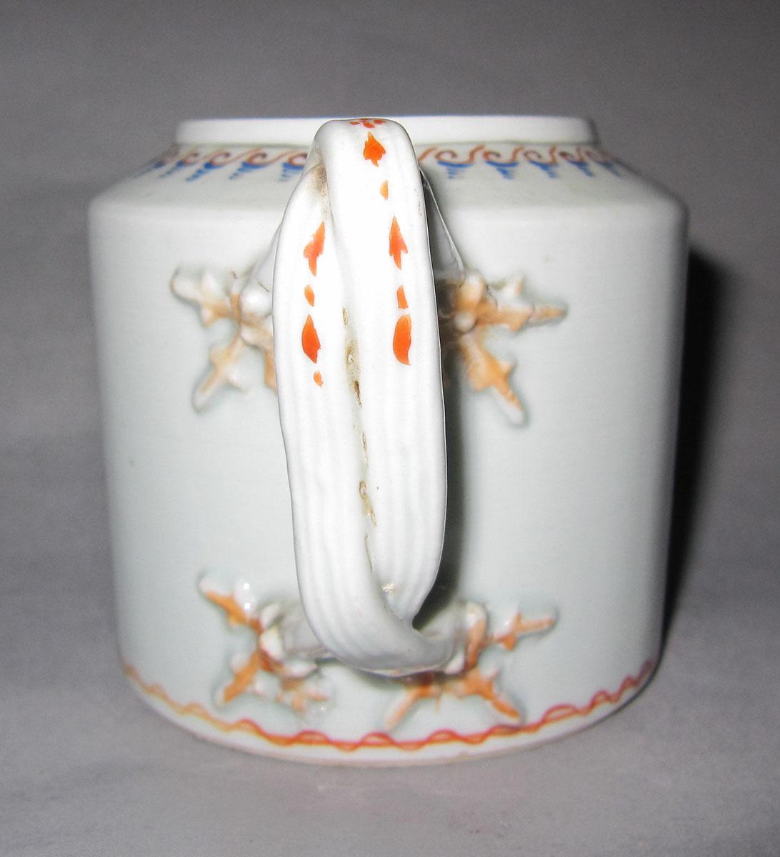 1963.0965 A Porcelain teapot handle