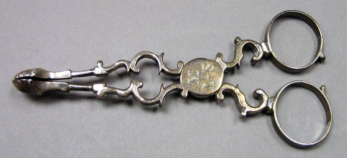 1964.0078 Silver Tongs upper surface