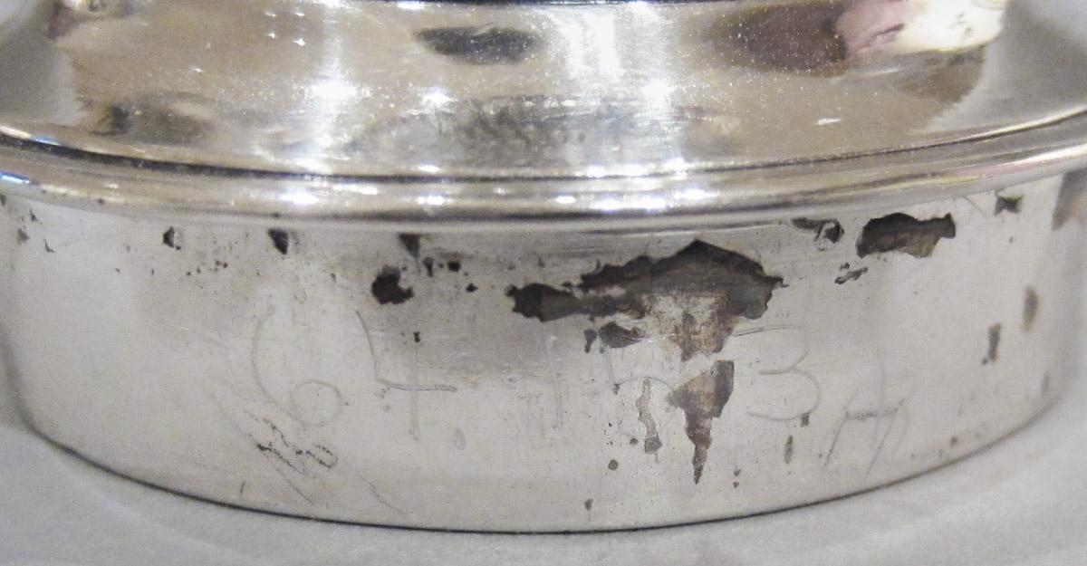 1964.0153 H Standish, candle cup, inscription