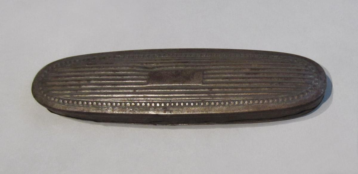1964.0188 A Spectacles case, underside