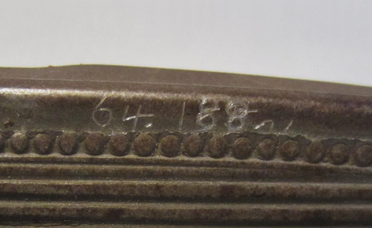 1964.0188 A Spectacles case, inscription