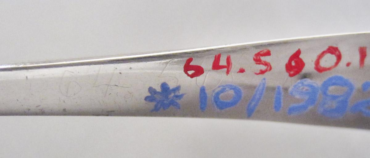 1964.0560.001 Spoon, inscription