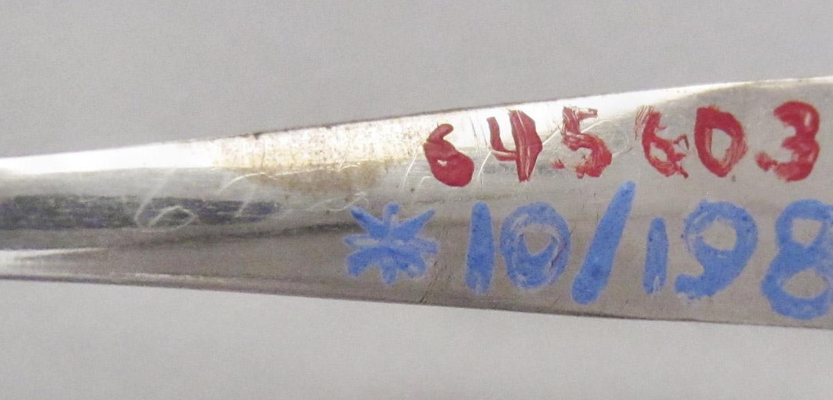 1964.0560.003 Spoon, inscription