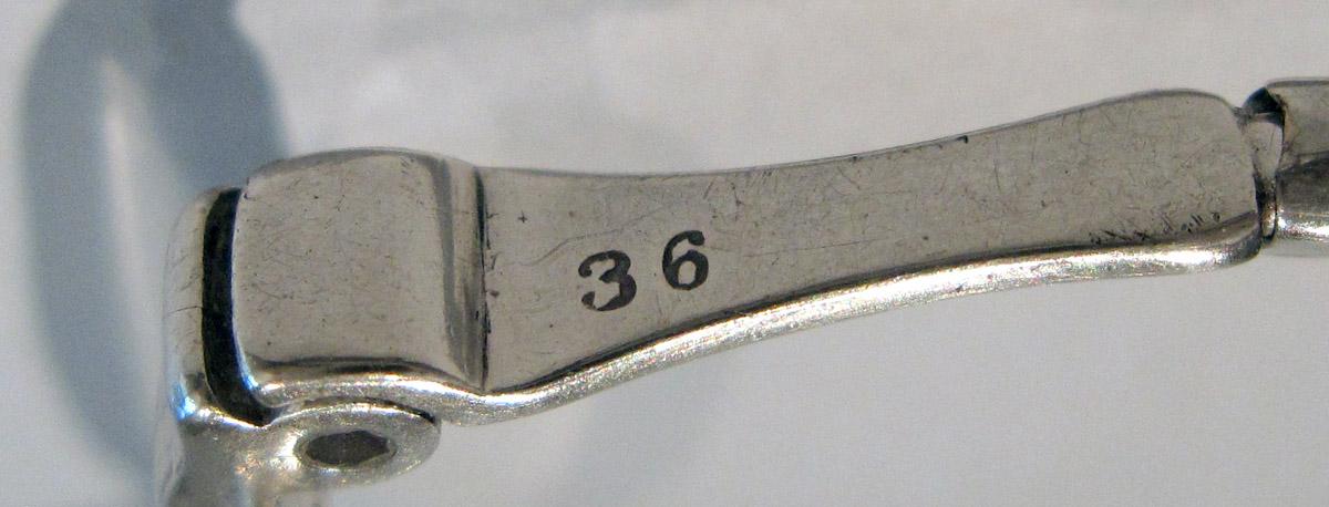 1964.0587 B Silver Spectacles mark 2