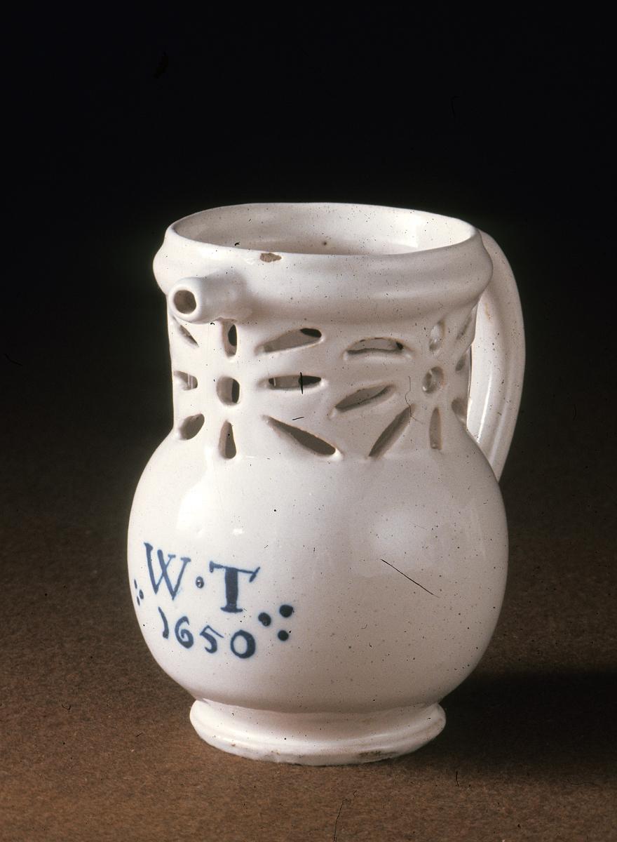 1964.0685 Faience puzzle jug
