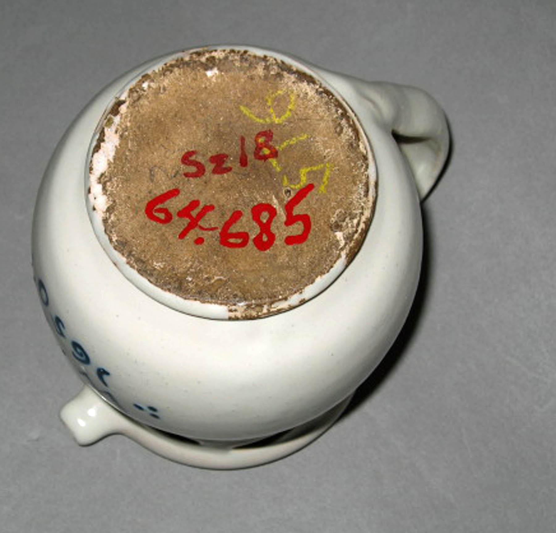 1964.0685 Faience puzzle jug (underside)