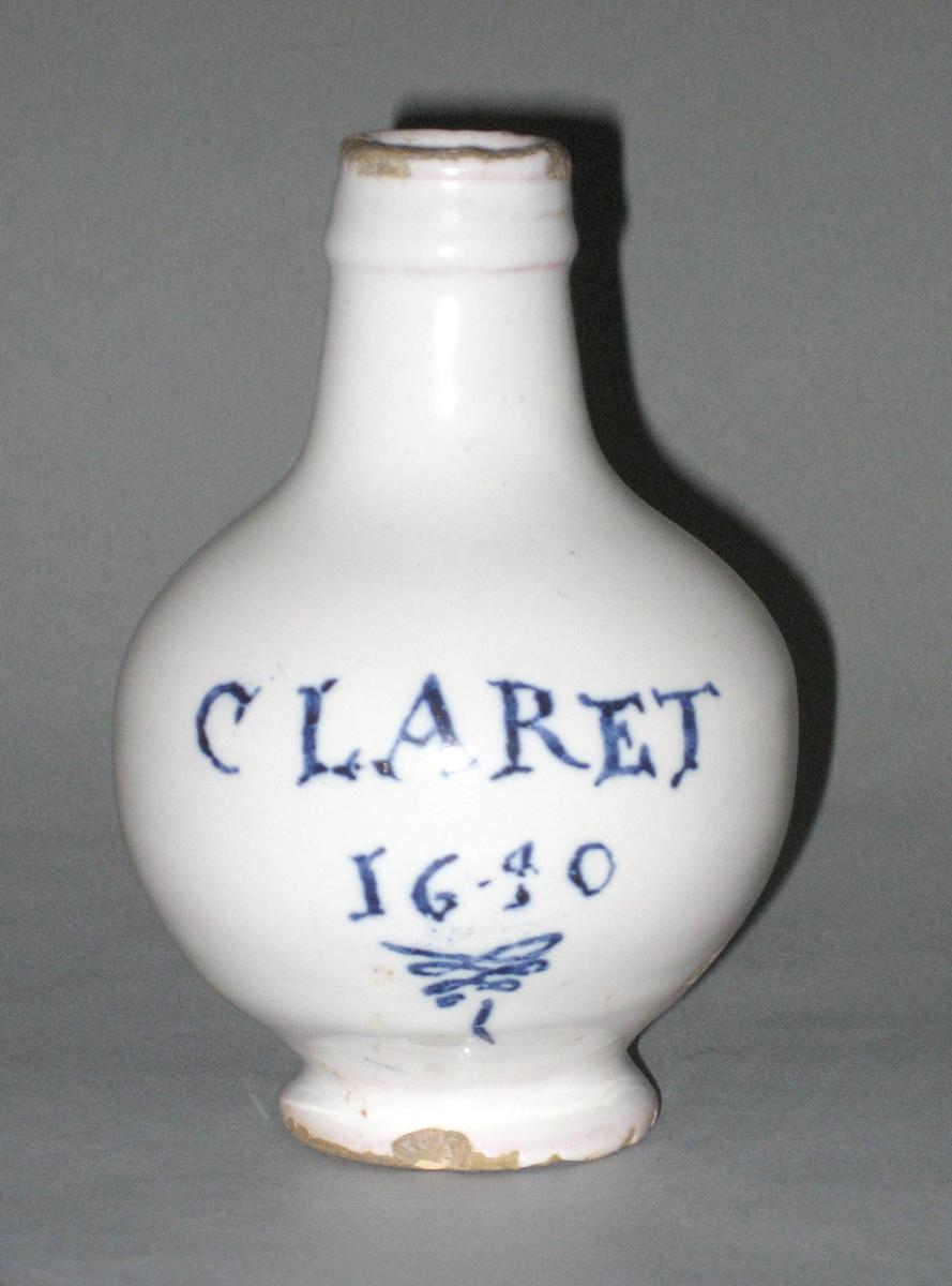 1964.0691 Delft wine bottle inscription
