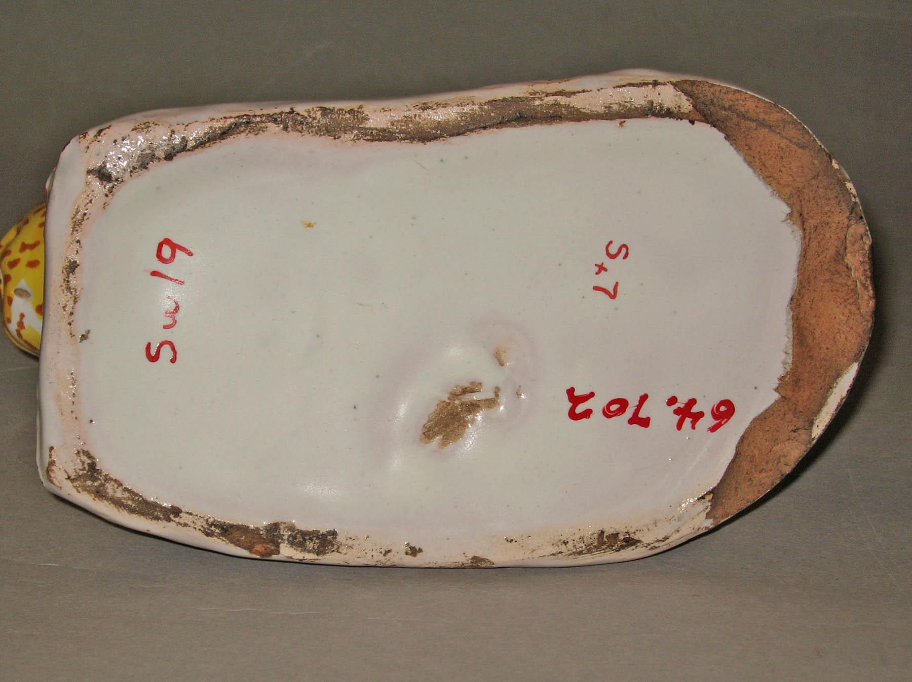 1964.0702 Earthenware figure of a cat (underside)