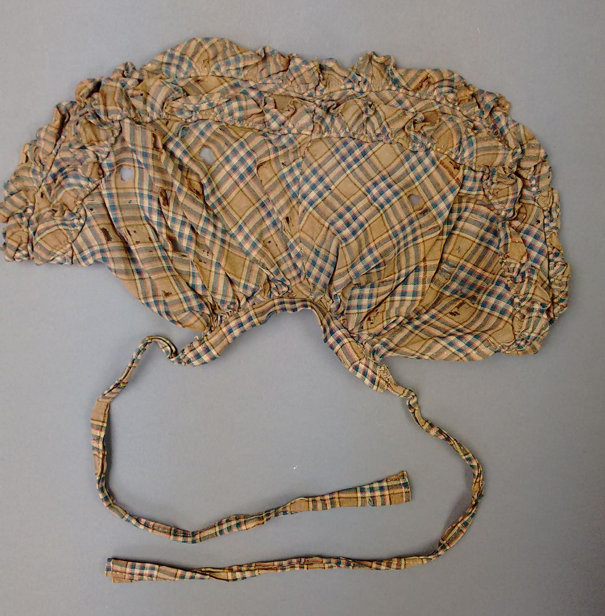 1964.0878 Doll, apron, view 1