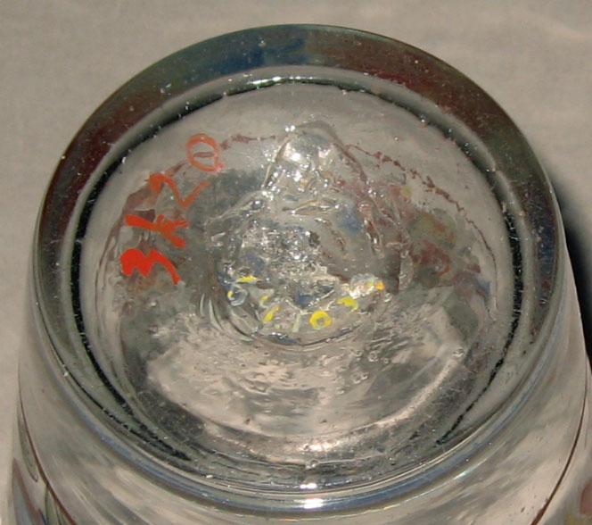 1964.1033 Colorless glass tumbler (underside)