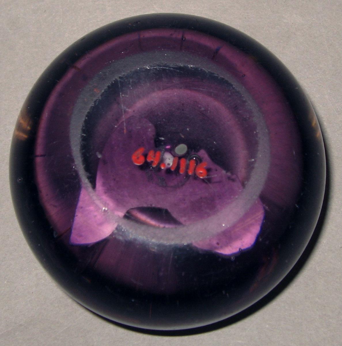 1964.1116 Glass paperweight (underside)