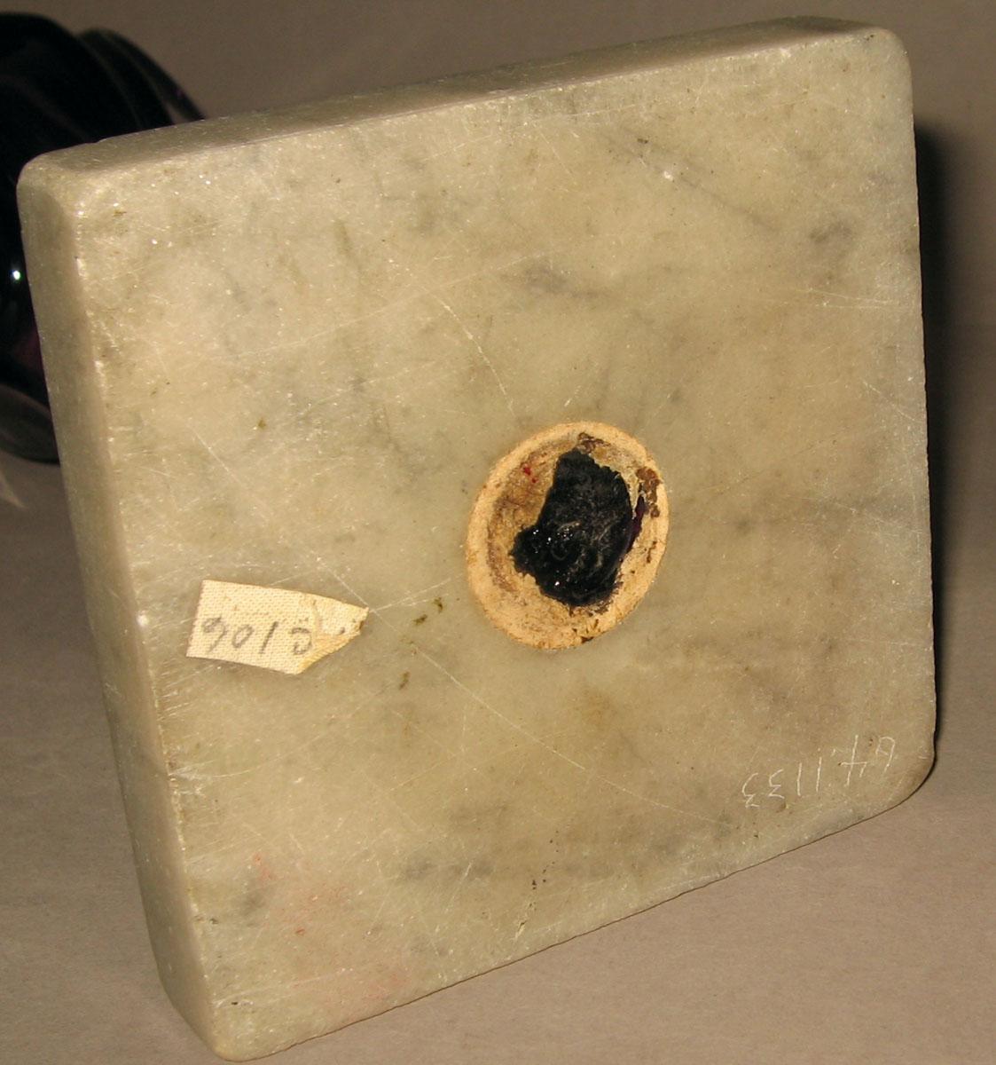1964.1133 Glass oil lamp (underside)