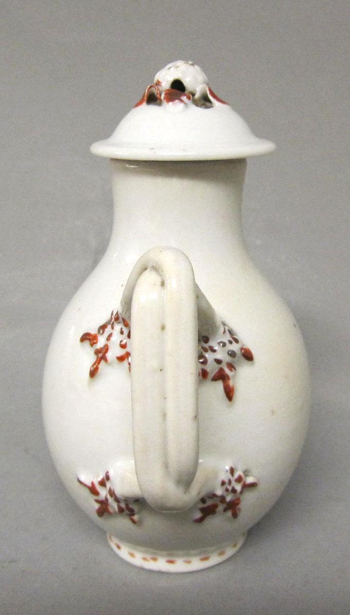 1964.1286.002 A,B Porcelain jug and cover handle