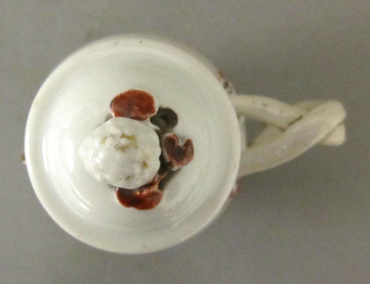 1964.1286.002 A,B Porcelain jug and cover top