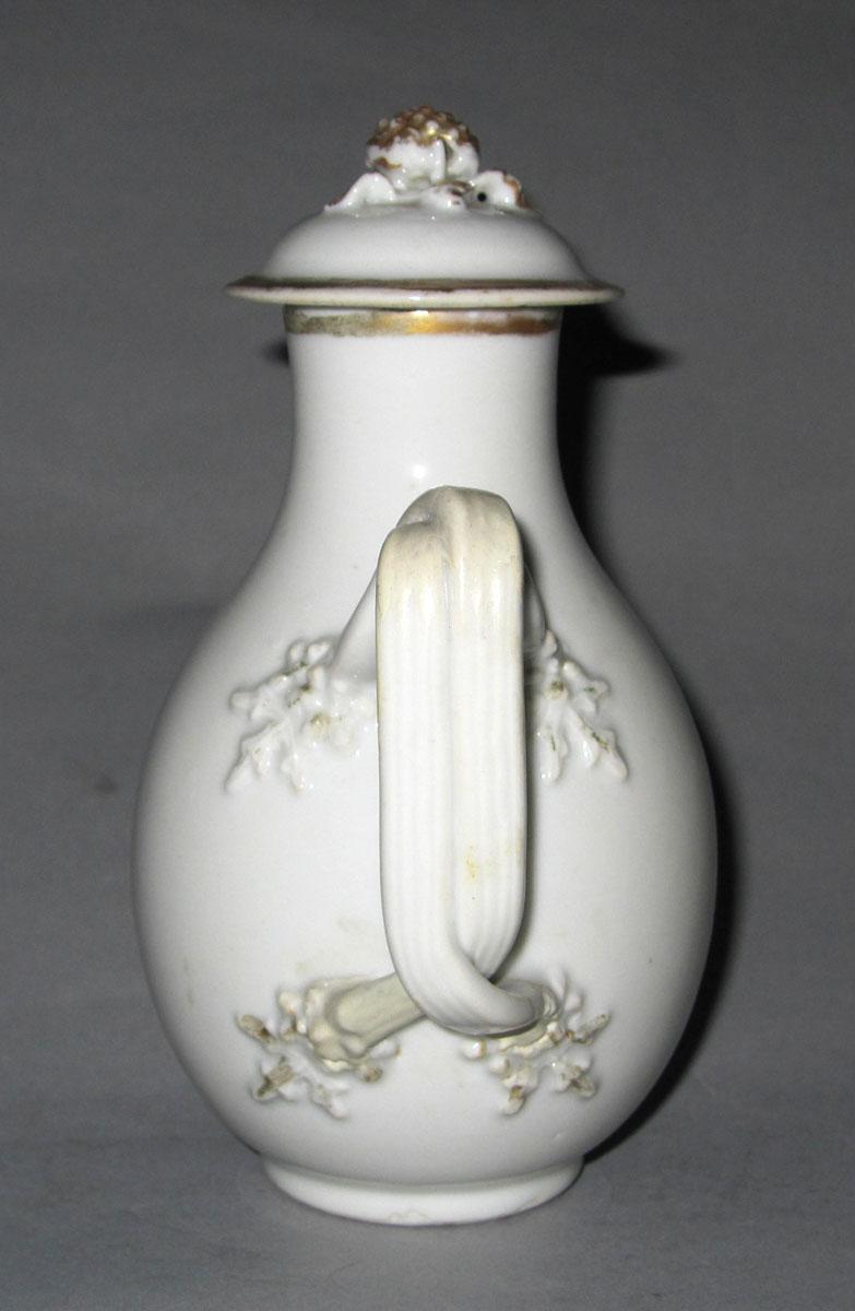 1964.1290 A,B Porcelain jug and cover handle
