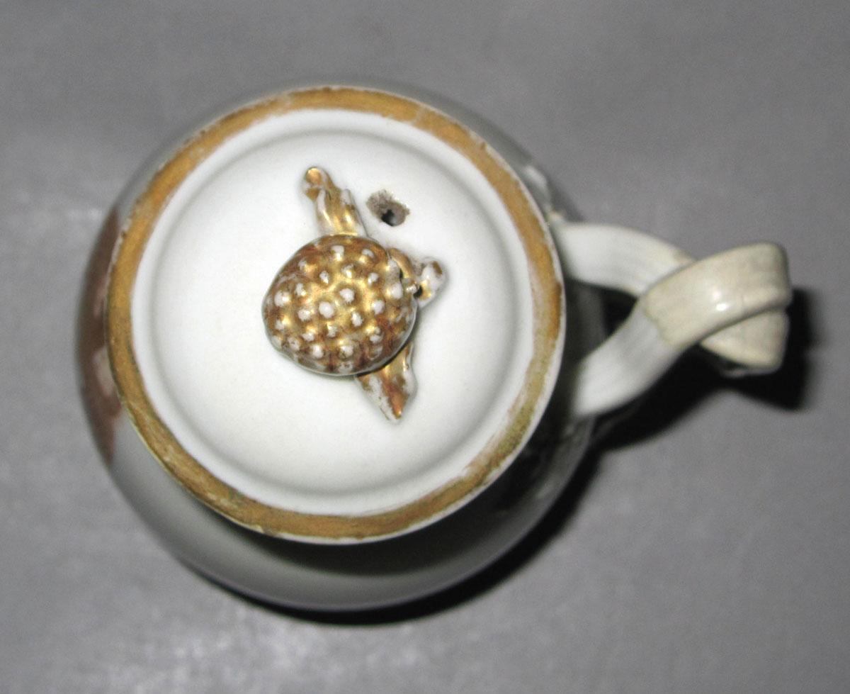1964.1290 A,B Porcelain jug and cover top