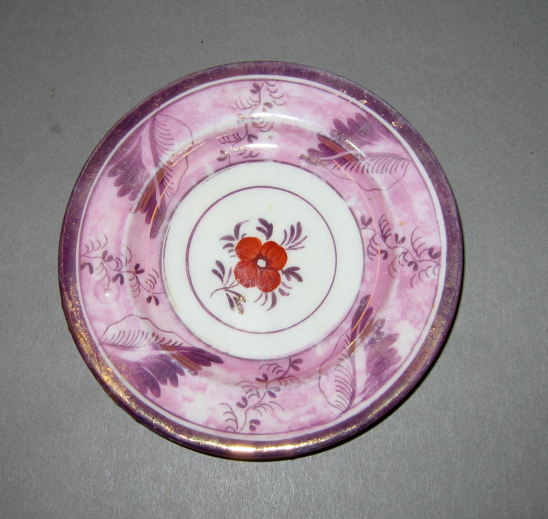 1964.1306.002 Pink luster cup plate