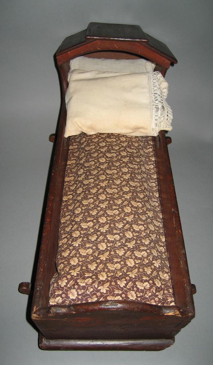 1964.2072 A-E Miniature pillows, mattress, sheet, bedcover in 1964.1510 in 1964.1344 Miniature cradle
