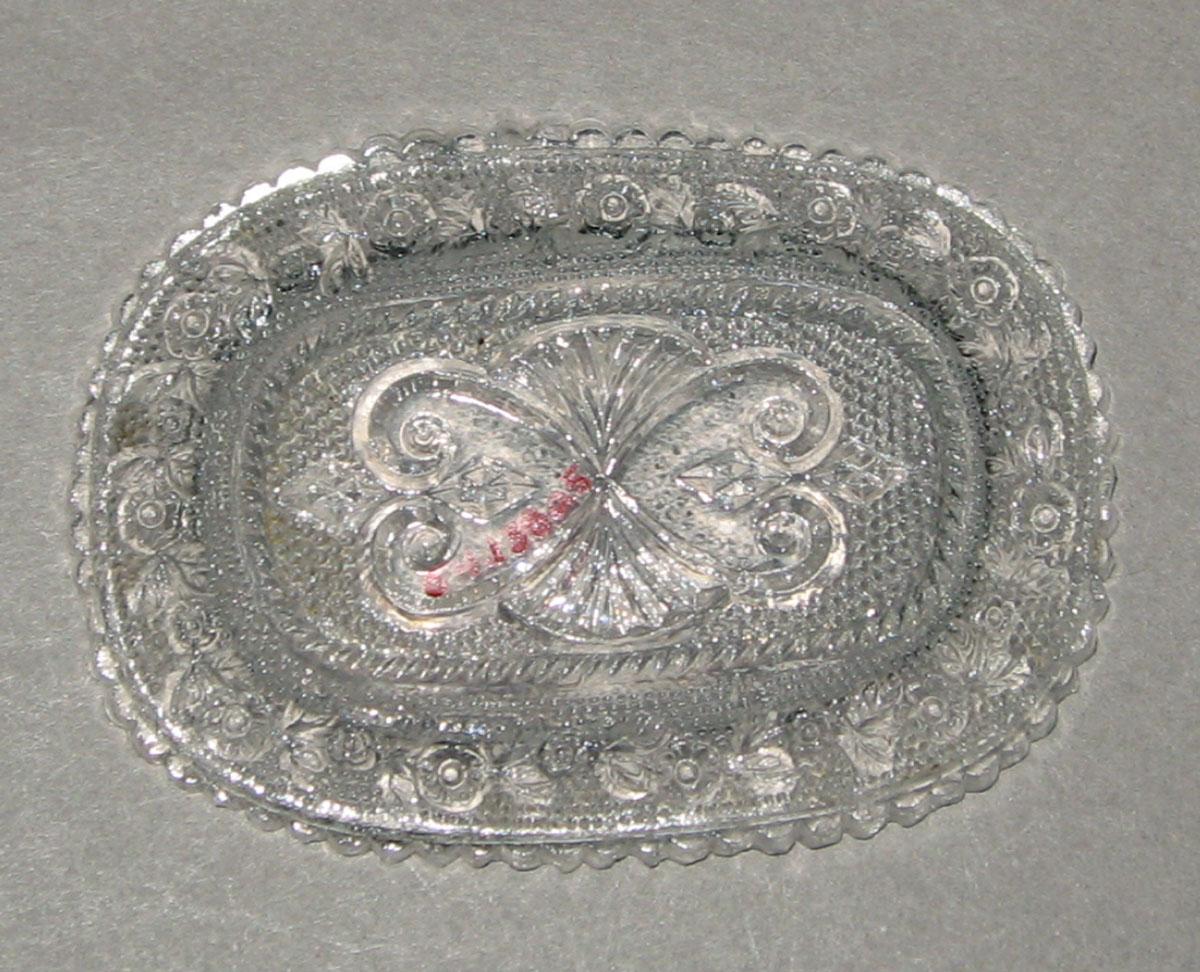 1964.1380.005 Pressed glass miniature dish (underside)
