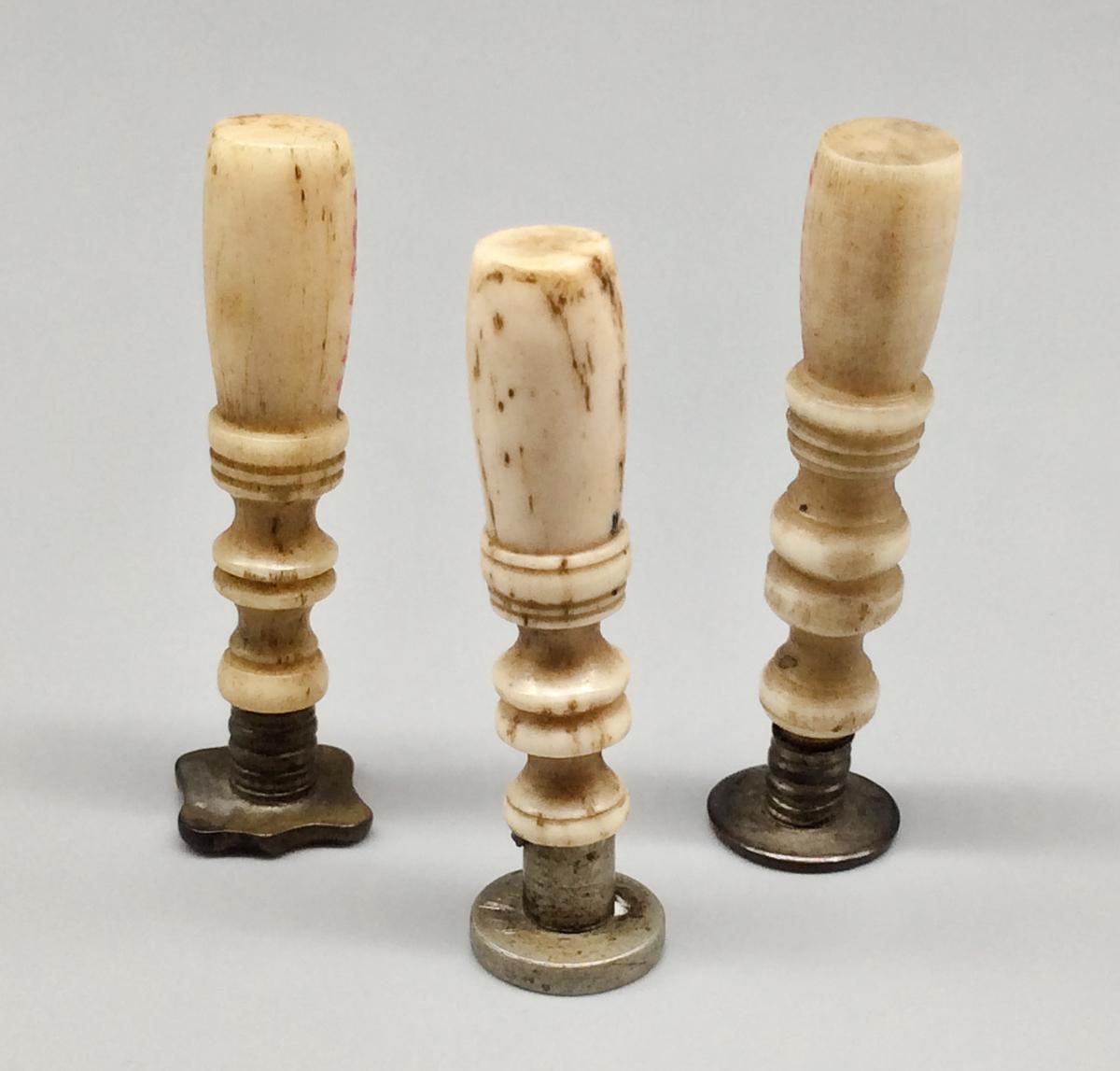 1964.1389, .1391, and .1392 Sealing stamp, view 1