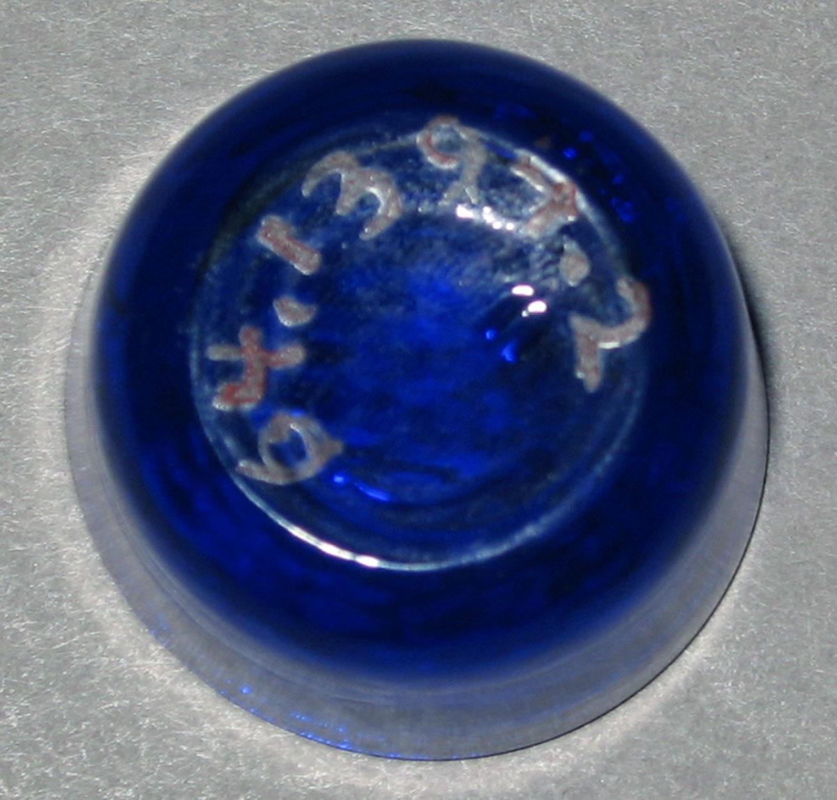 1964.1394.002 Miniature blue glass tumbler (underside)