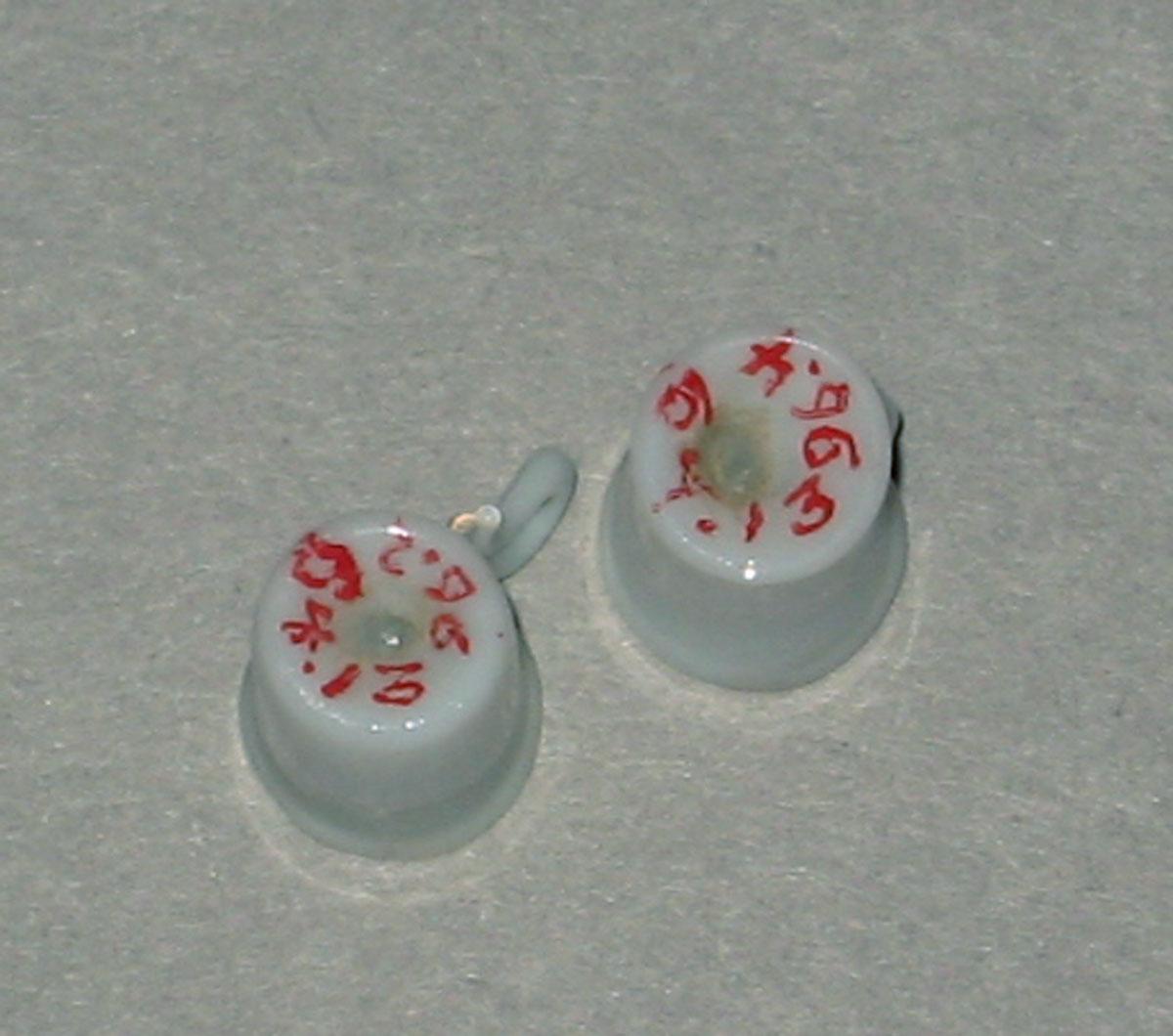 1964.1396.002, .004 Miniature glass teacups (underside)