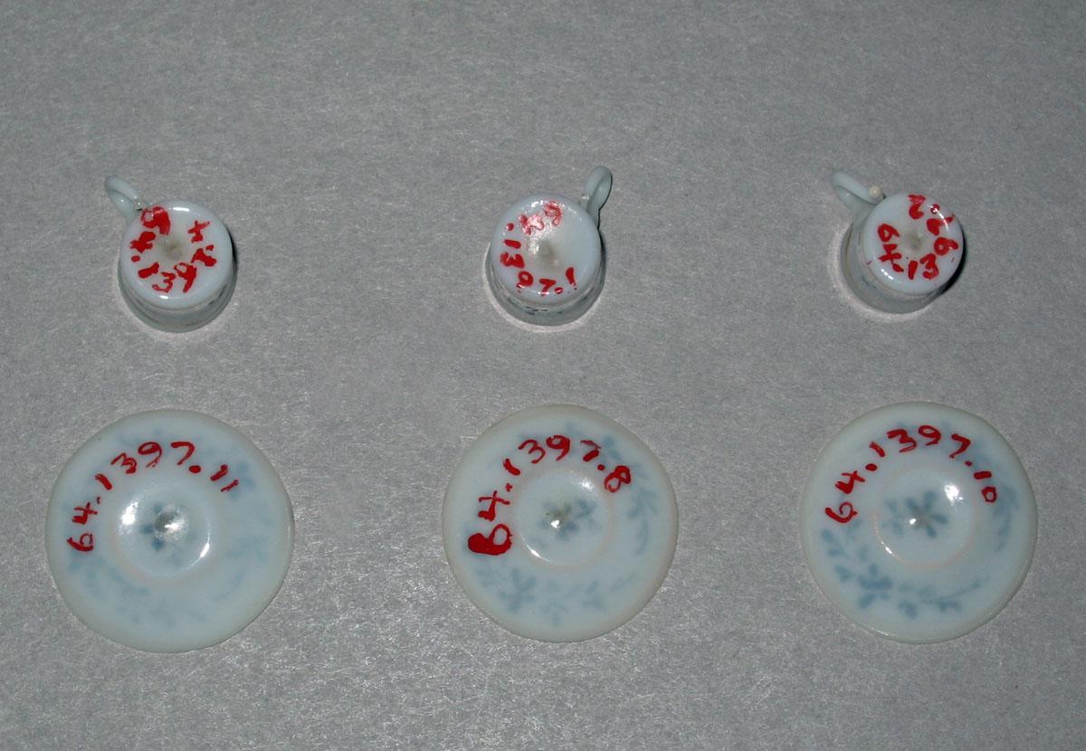 1964.1397.001, .002, .004, .011, .008, .010 Miniature teacups and saucers (undersides)