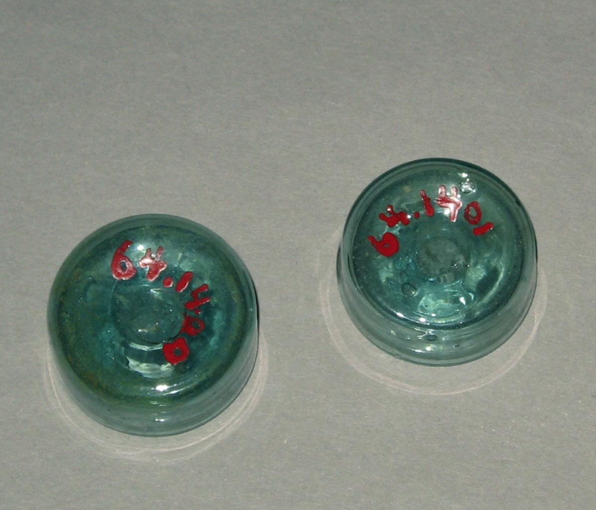 1964.1400, .1401 Miniature glass inkwells (undersides)