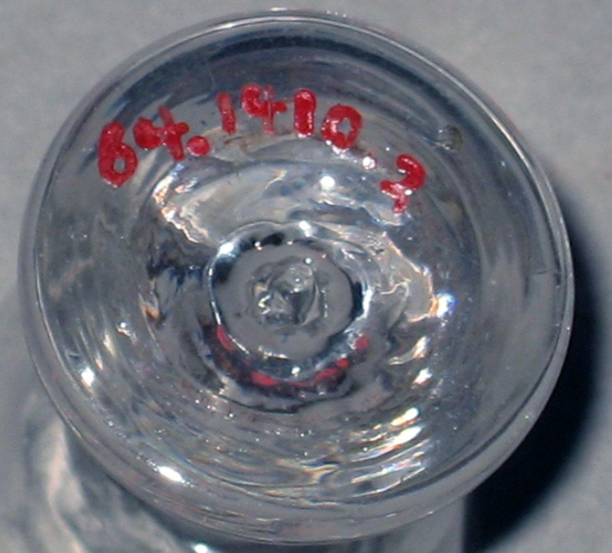 1964.1410.002 Miniature glass wineglass (underside)