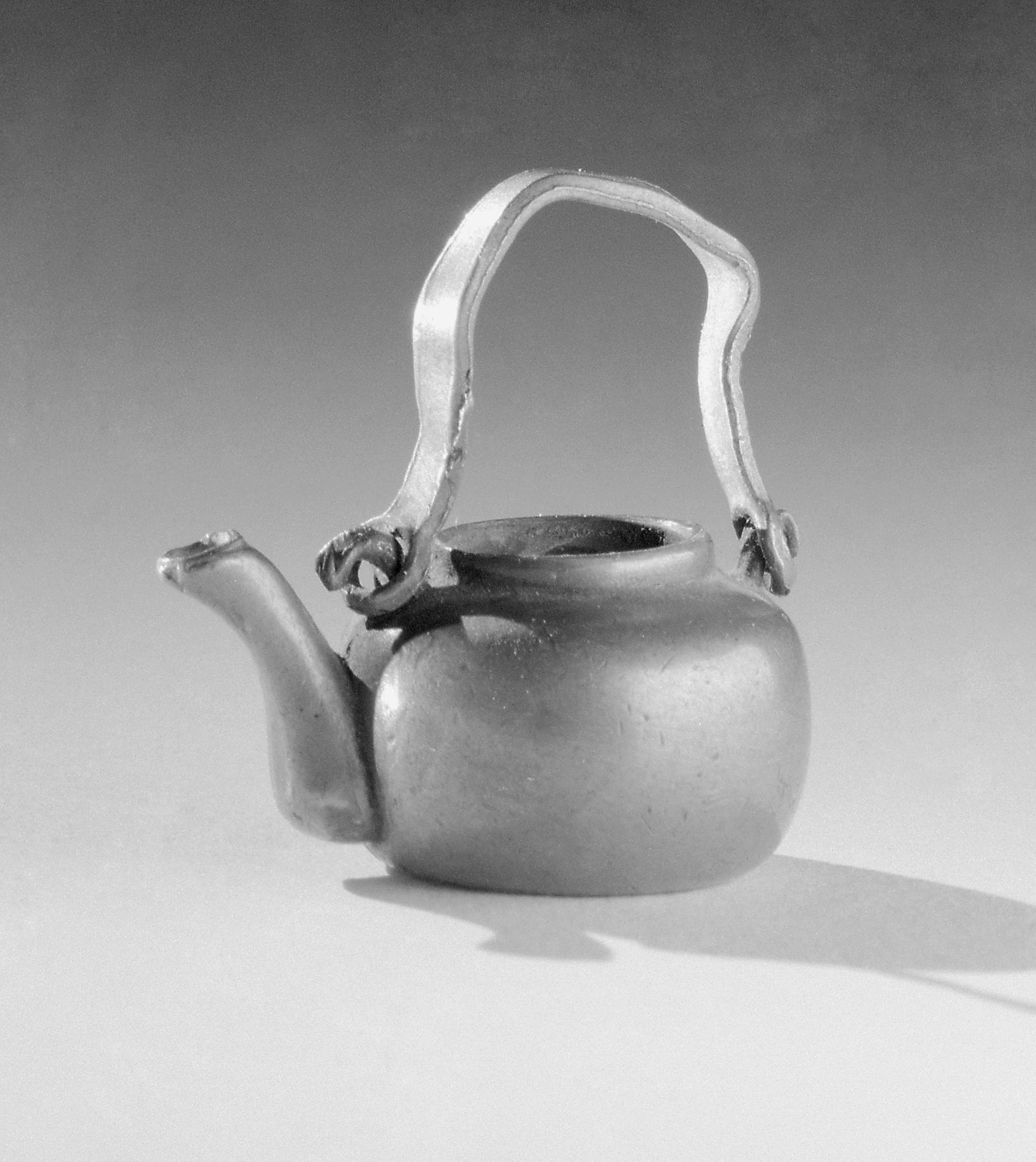 1964.1446 Miniature pewter teapot