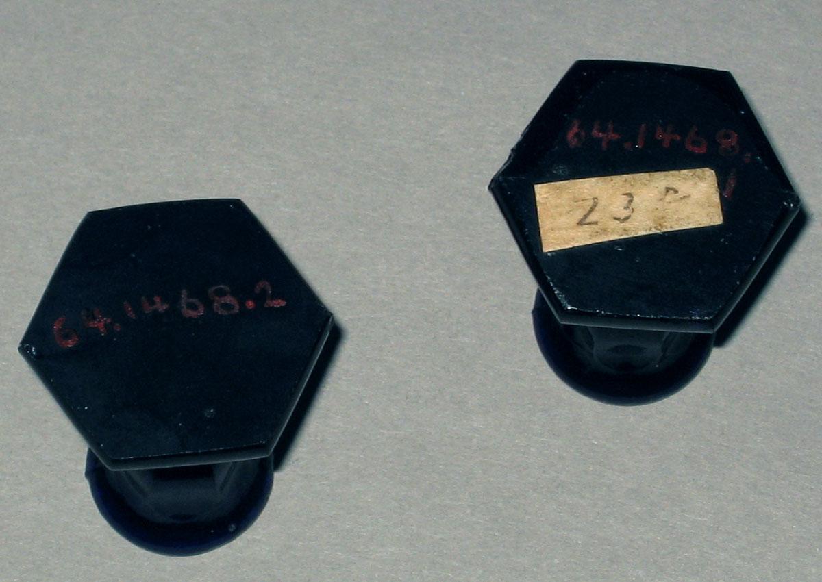 1964.1468.001, .002 Miniature glass candlesticks (undersides)
