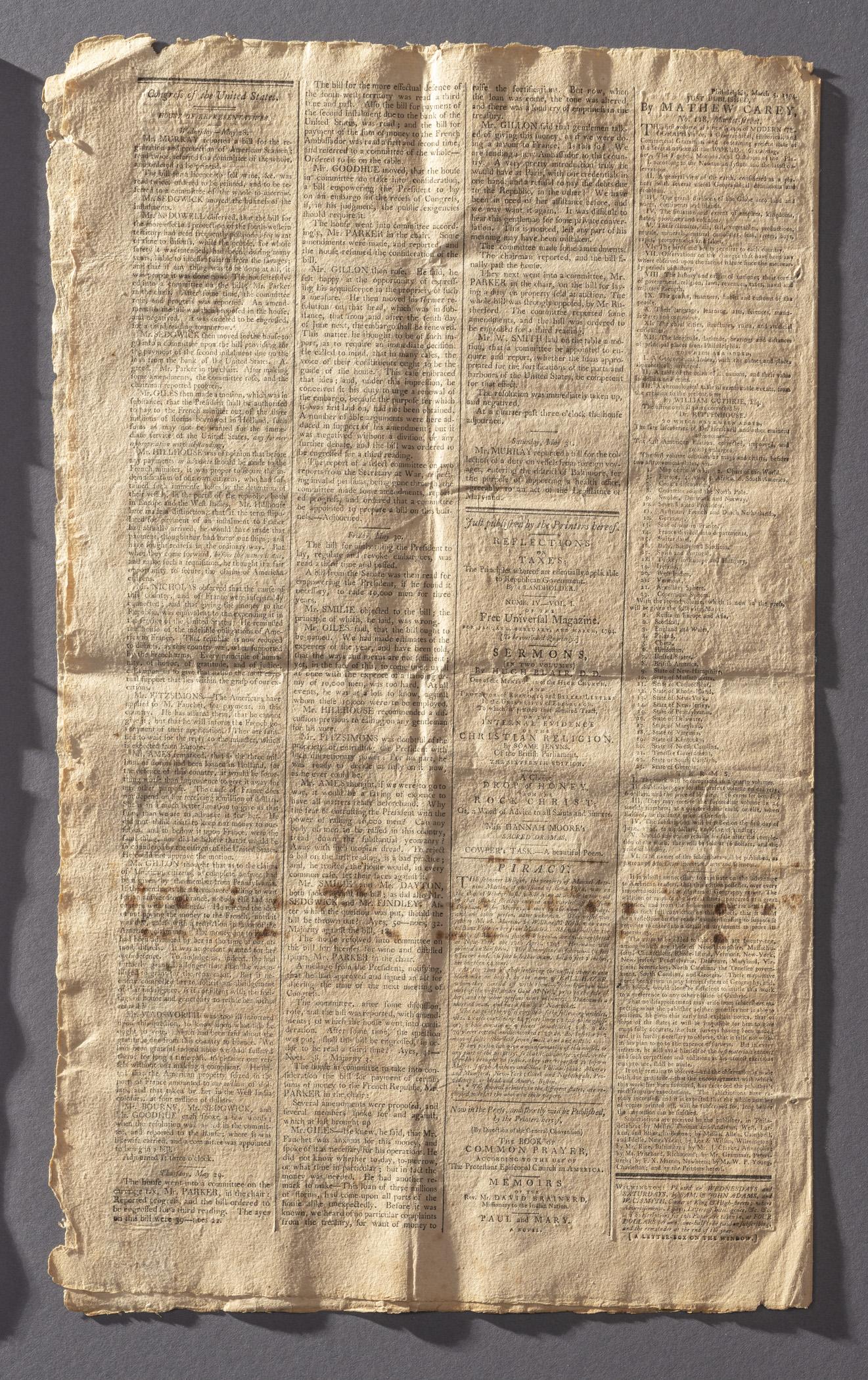 1964.1627 Newspaper, page 4, view 2, raking light