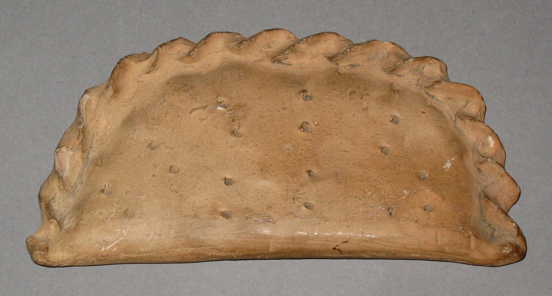 1964.1679 Chalkware pastry or turnover