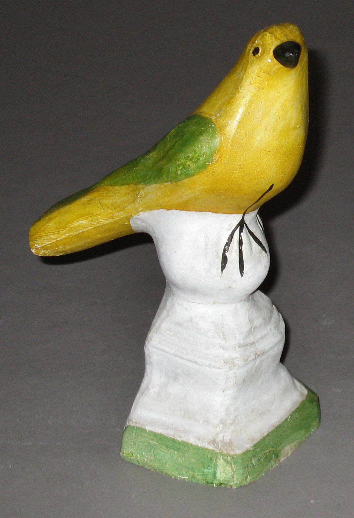 1964.1694 Chalkware bird on ball