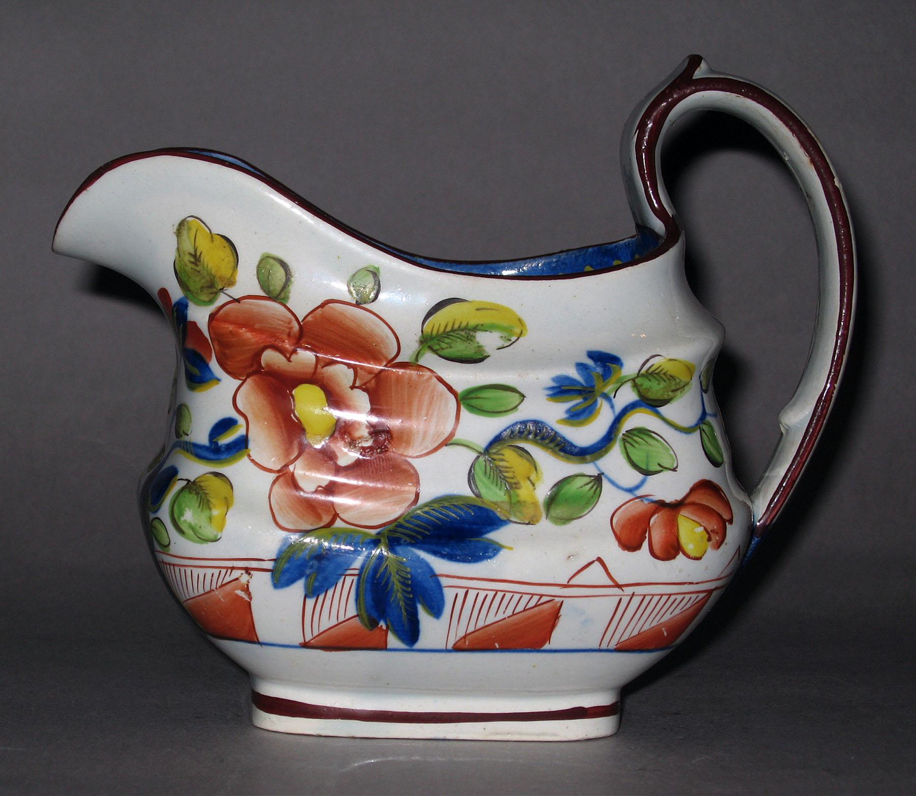 1964.1810.005 Pearlware single rose pattern cream jug