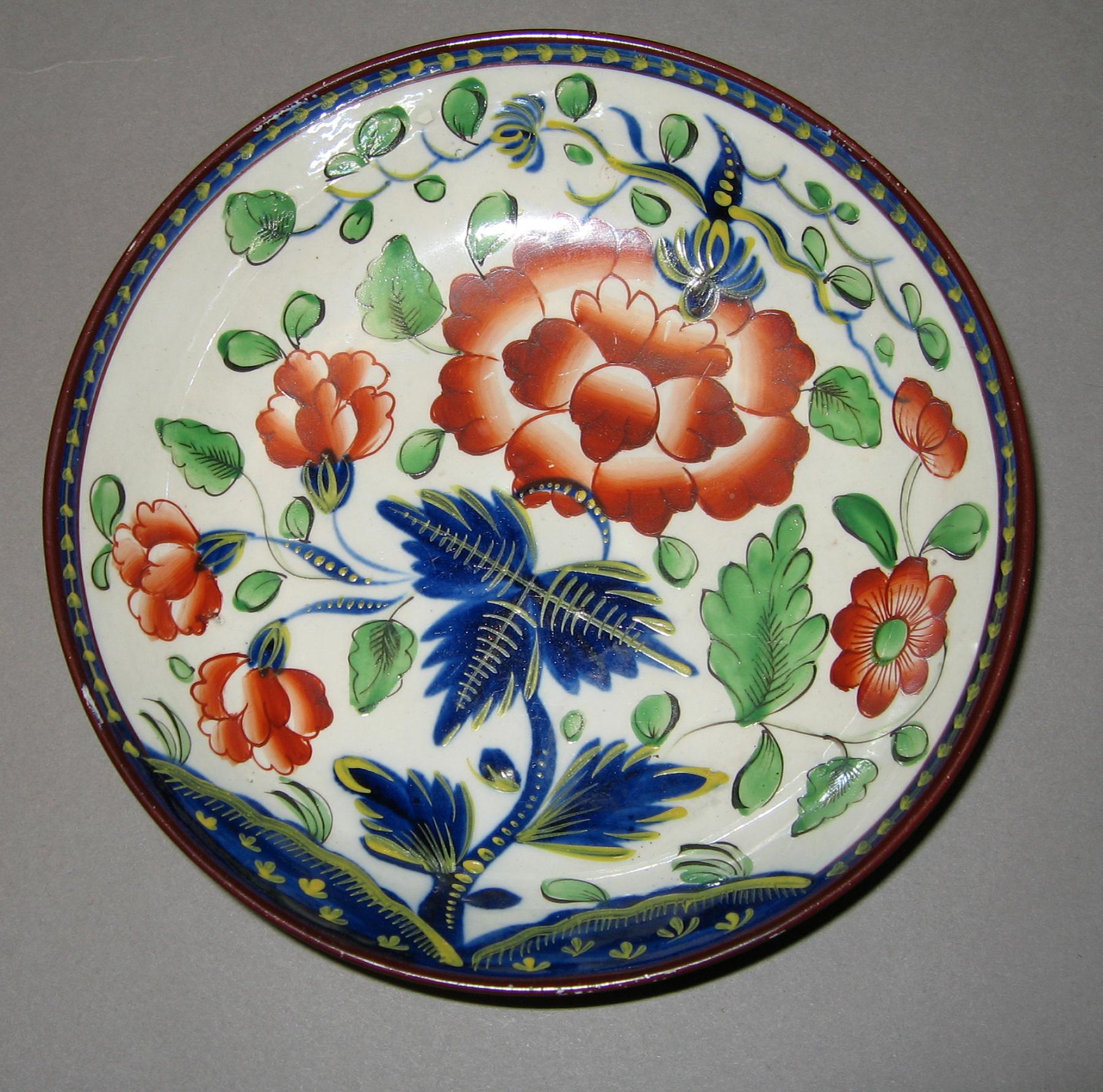 1964.1818.006 Gaudy dutch pearlware carnation saucer