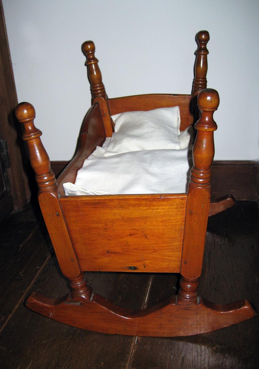 1964.2070 C,D Miniature pillow and sheet in 1964.1312 Cradle
