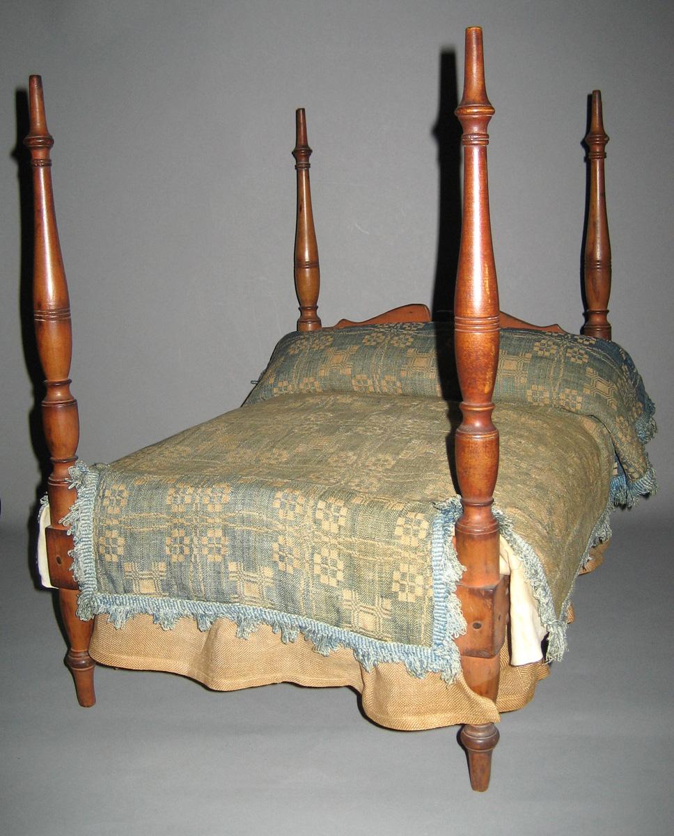 1964.1324 miniature bed with bedcover 1964.2071c view 1