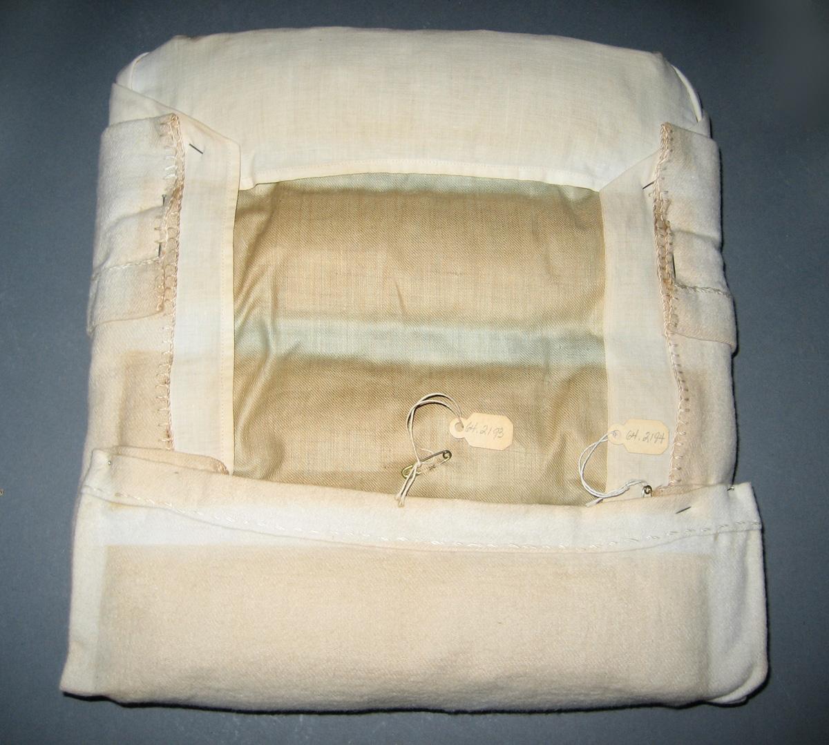 1964.2193 Miniature mattress cover and 1964.2194 Miniature blanket reverse