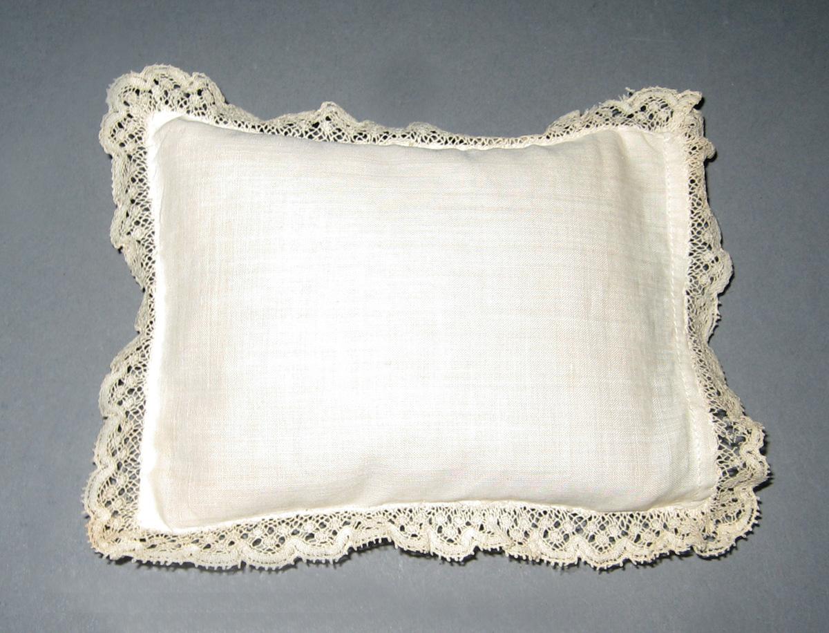 1964.2196.002 miniature pillow and 1964.2197.002 miniature pillowcase