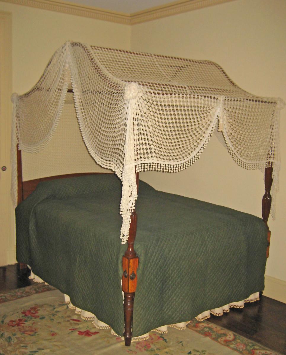 1955.0796 bedstead with quilt 1955.0662.003 and bedhangings 1955.0662 view 1