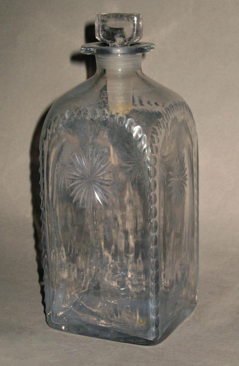 1965.0073 D Colorless glass case bottle