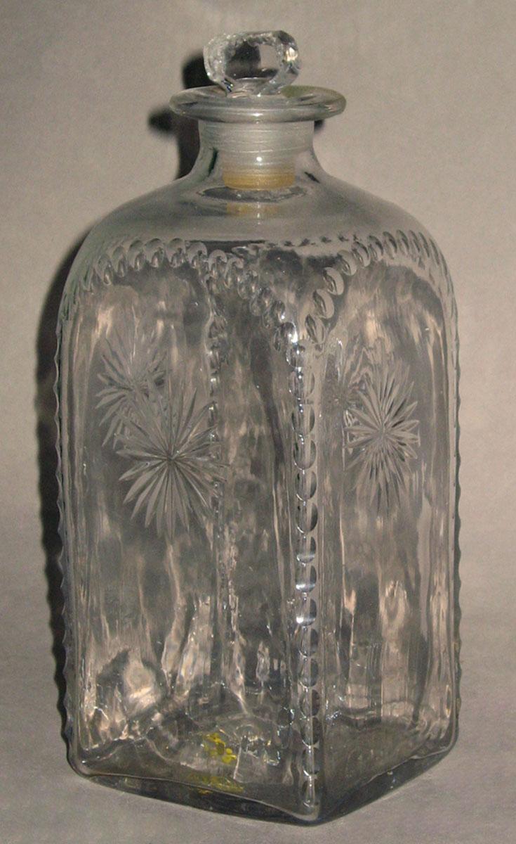 1965.0073 E Colorless glass case bottle